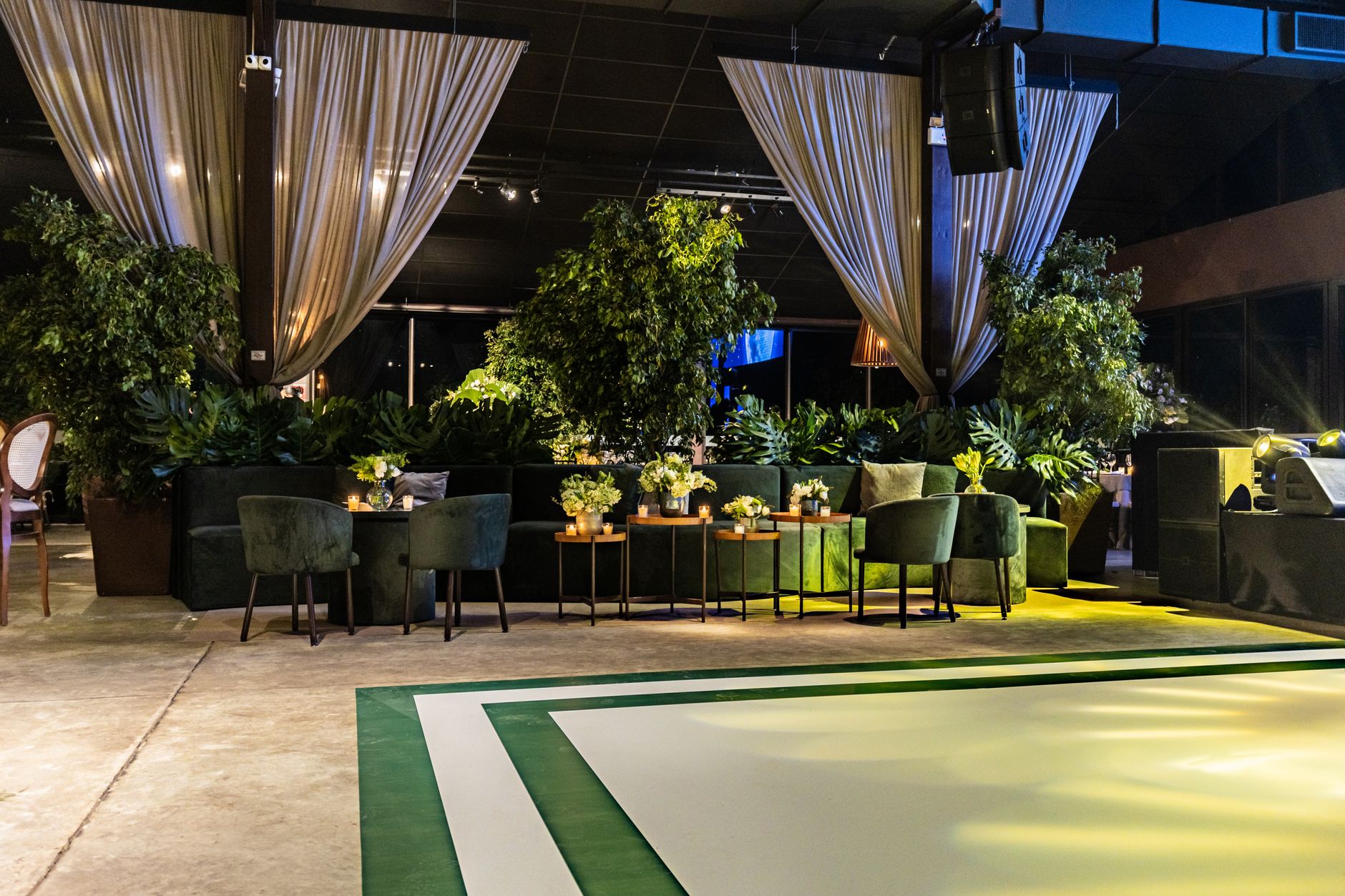 A stylish, modern indoor venue with lush greenery, drapes — Elevate Your Home Efficiency: The Rising Trend of Loft Ladders